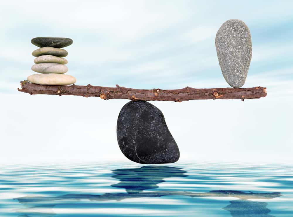 picture depicting a fulcrum with stones balanced on it to illustrate life balance