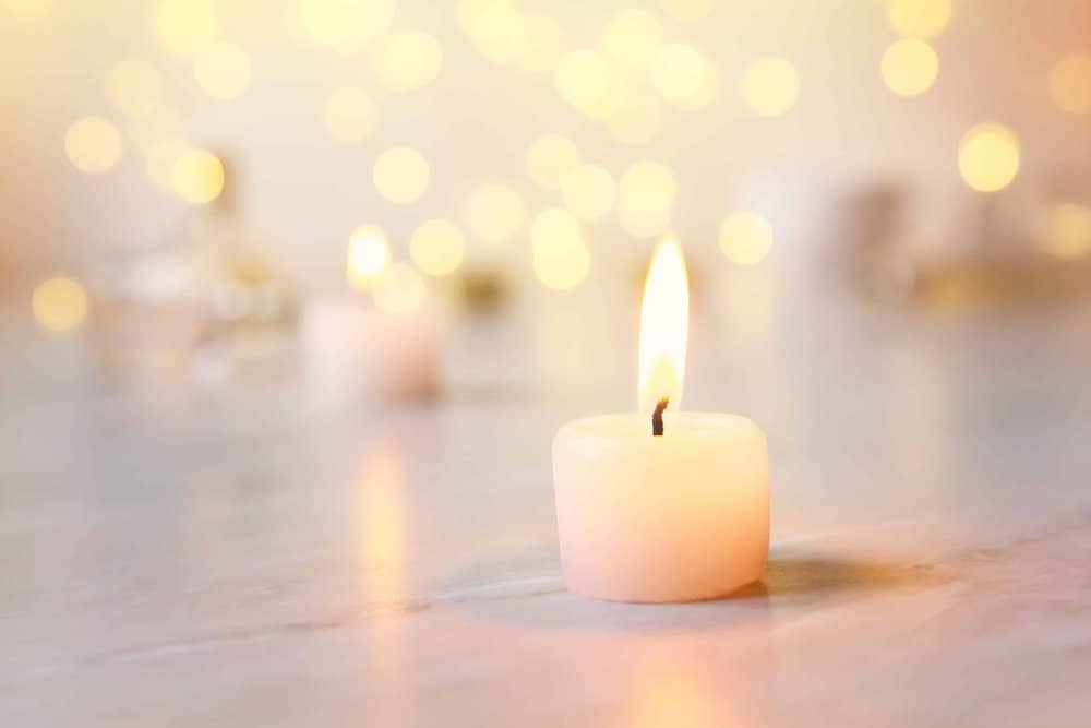 image of a votive candle on a floor